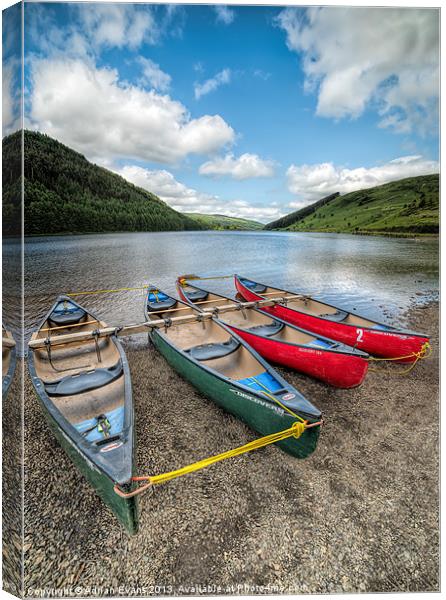 Canoes at Geirionydd Lake Canvas Print by Adrian Evans