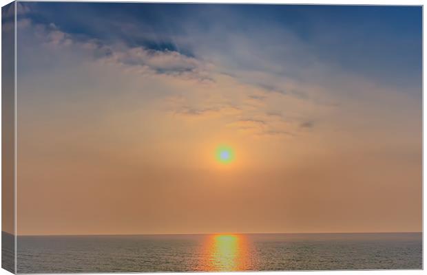 Sun rise over the sea Canvas Print by Dean Messenger