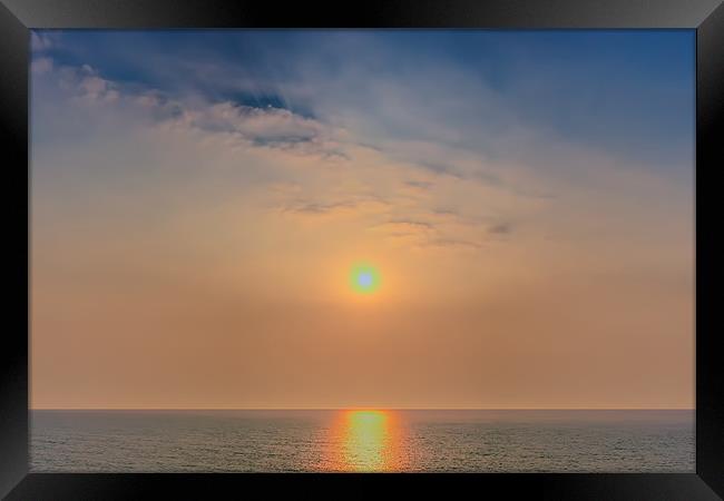 Sun rise over the sea Framed Print by Dean Messenger