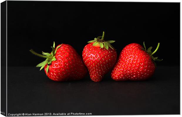 Three Strawberries On Black Canvas Print by Alan Harman