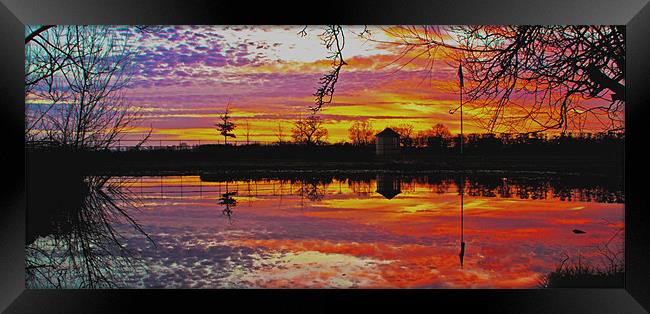 Reflection of a sunset Framed Print by Ian Flear
