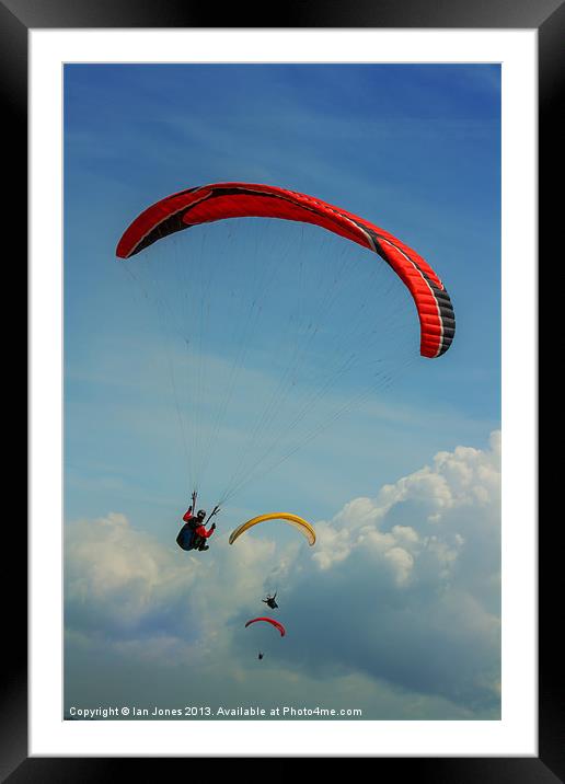 Paragliding on the coast Framed Mounted Print by Ian Jones
