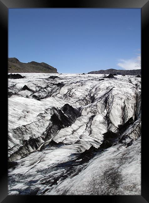 Volcanic ash on glacier. Framed Print by Kay Gorzko
