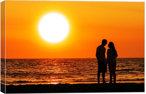 FLIRTING AT THE BEACHS SUNSET Canvas Print by Ankor Light