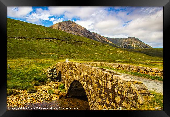 Bridge to the mountains Framed Print by Ian Purdy