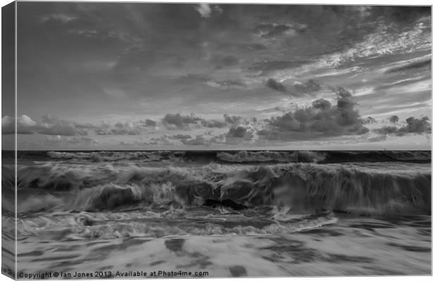Waves breaking on the beach Canvas Print by Ian Jones