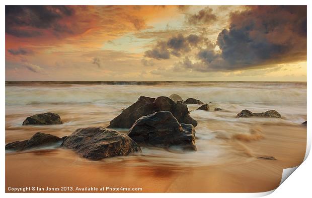 Sunset over the rocks Print by Ian Jones