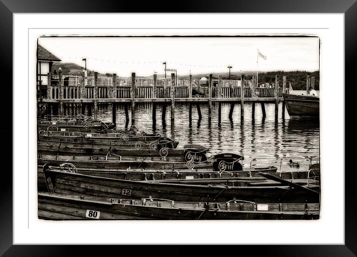 rowing boats on the pier Framed Mounted Print by jane dickie