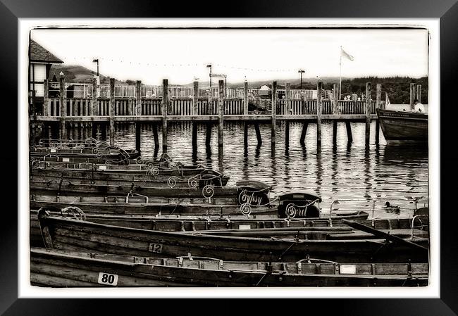 rowing boats on the pier Framed Print by jane dickie