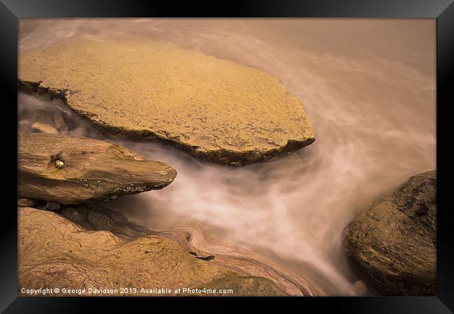 Rocks in the Sea Framed Print by George Davidson