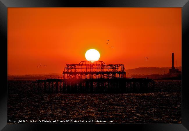 Sunset Over The West Pier Framed Print by Chris Lord