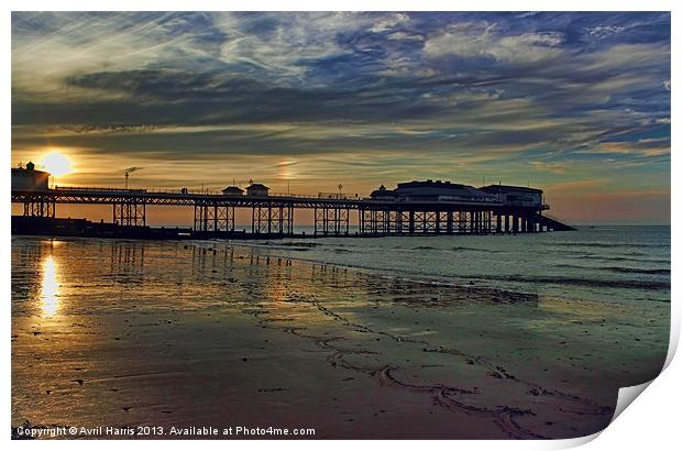Cromer Pier at sunset Print by Avril Harris