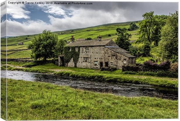 Cottage alongside the River Wharfe Canvas Print by Trevor Kersley RIP