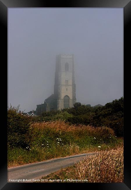 Ghostly Happisburgh church in a sea fret Framed Print by Avril Harris