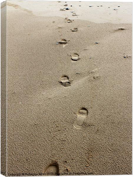 Footprint in the sand Canvas Print by Rebecca Giles