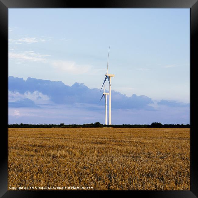 Evening sky and rural Wind turbines. Framed Print by Liam Grant