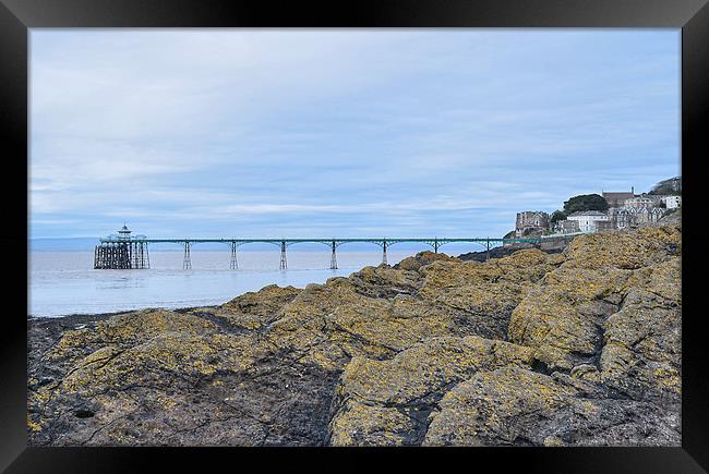 Clevedon Pier behind the rocks Framed Print by Levente Baroczi