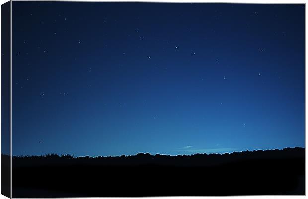 the Sky at Night Canvas Print by Dean Messenger