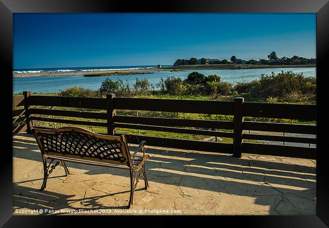 Empty Chair at the Beach Framed Print by Panas Wiwatpanachat