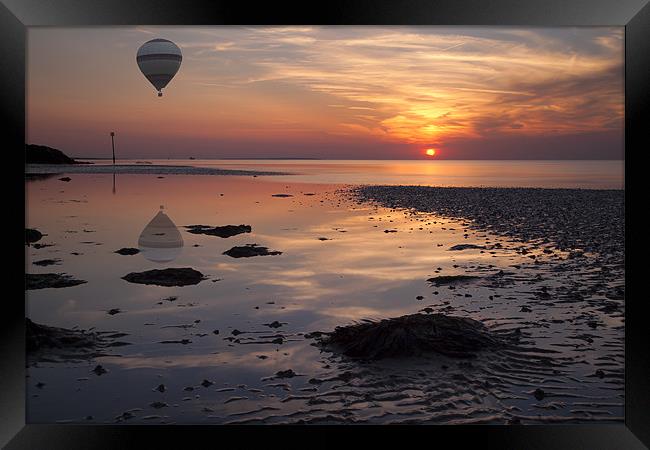 Floating at Sunset Framed Print by Nigel Jones