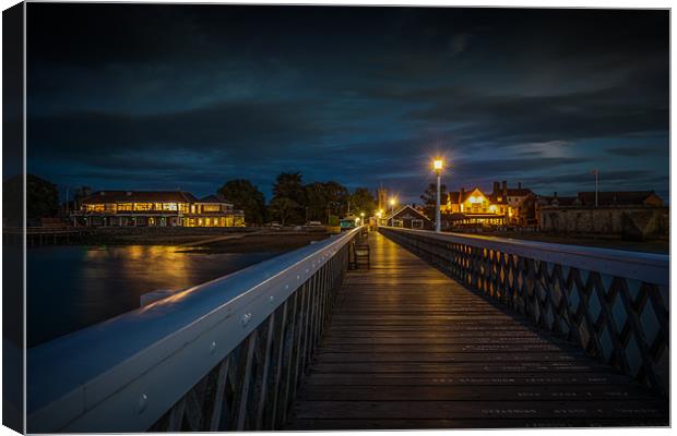Night - Time Pier towards the shore Canvas Print by Ian Johnston  LRPS