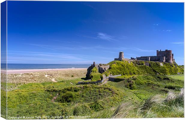 Bamburgh castle and beach Canvas Print by Kevin Tate