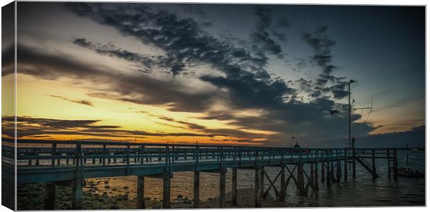 Sunset at Yarmouth over the pier Canvas Print by Ian Johnston  LRPS