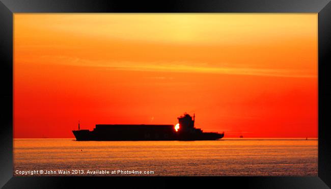 Sunset Silhouette Ship Framed Print by John Wain