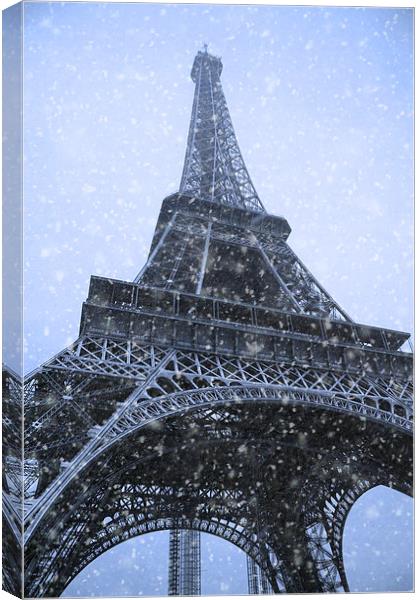 Majestic Eiffel Tower in Winter Wonderland Canvas Print by Les McLuckie