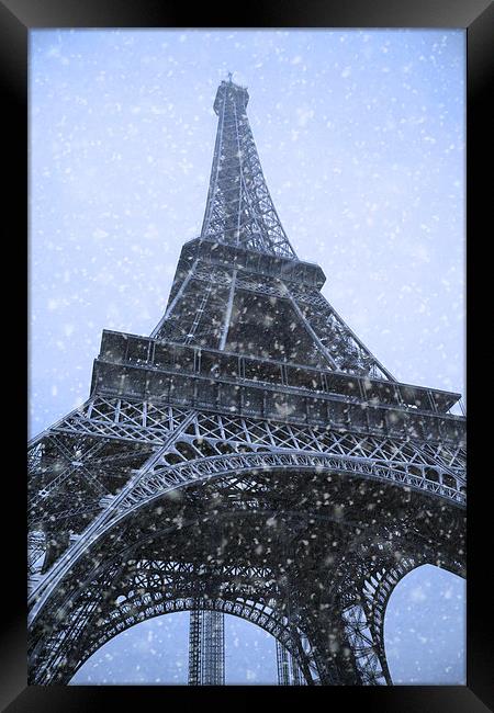 Majestic Eiffel Tower in Winter Wonderland Framed Print by Les McLuckie