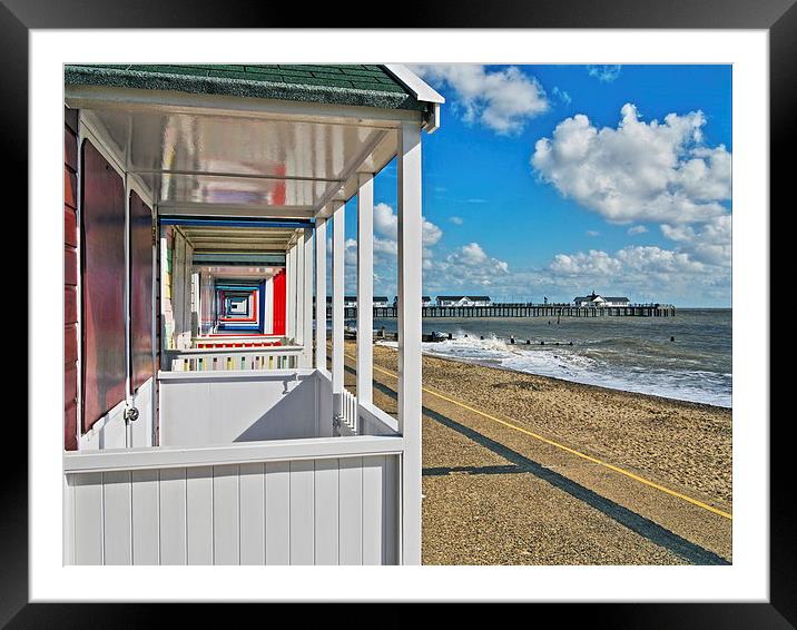 Southwold Pier Through Beach Huts Framed Mounted Print by Bill Simpson