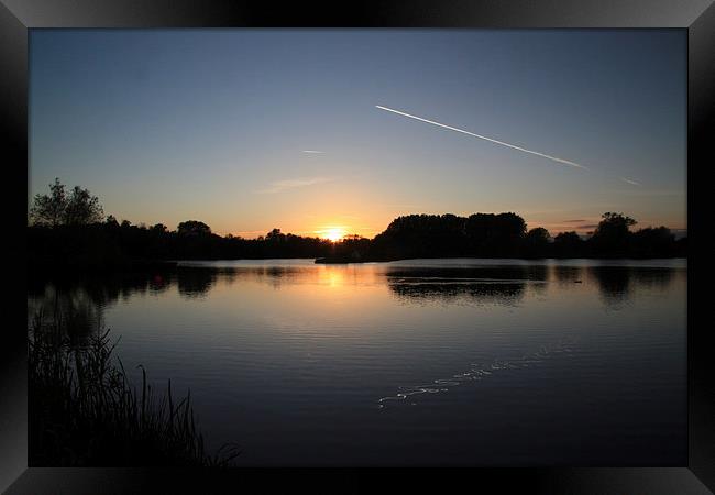 Lake, Sunset, Plane and Eel. Framed Print by Tony Dimech