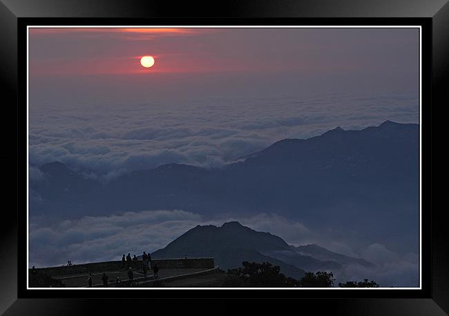Sunset Above the Clouds Framed Print by Art Magdaluyo