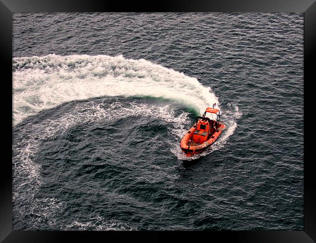 Lifeboat Causing a Swirl . Framed Print by Bill Lighterness