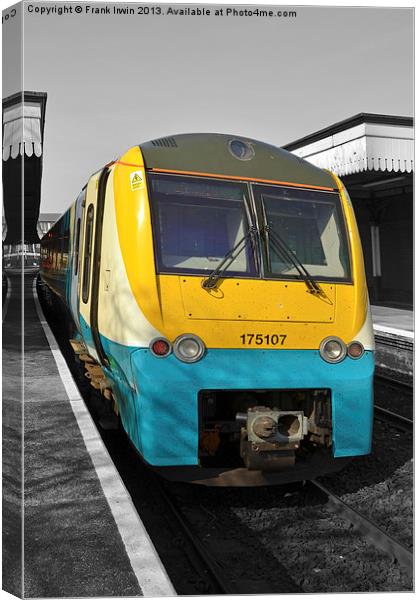 An Arriva train leaving Colwyn bay station. Canvas Print by Frank Irwin