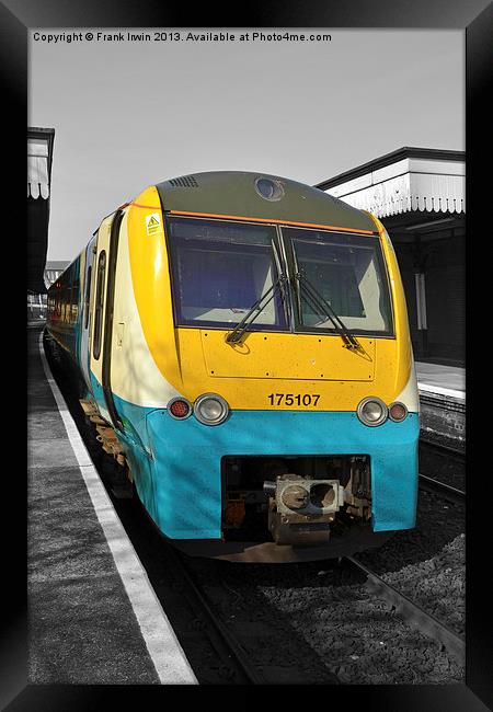 An Arriva train leaving Colwyn bay station. Framed Print by Frank Irwin