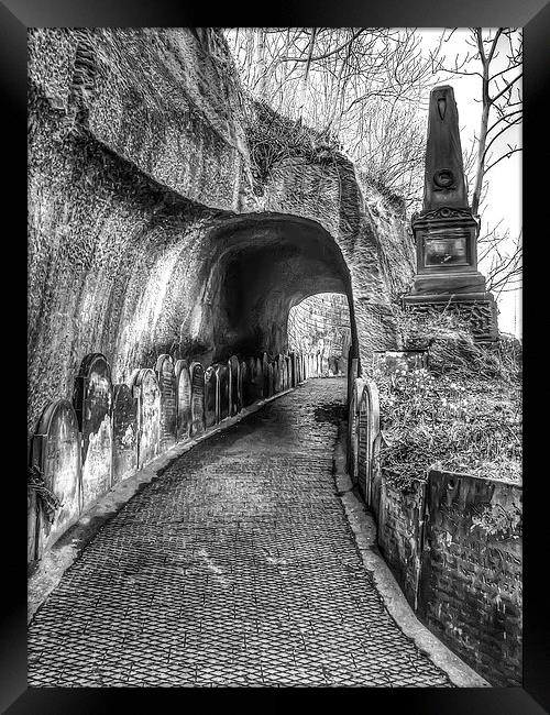 Spooky tunnel Framed Print by Paul Madden