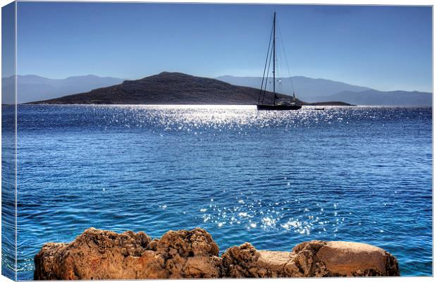 Yacht in front of Nissaki Canvas Print by Tom Gomez