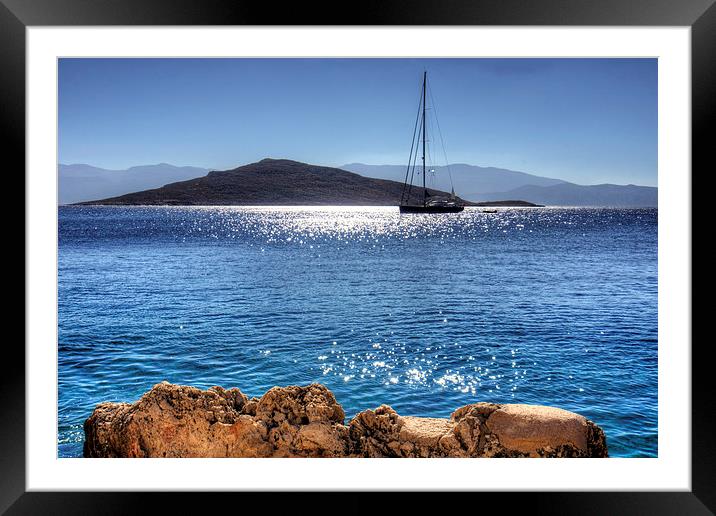 Yacht in front of Nissaki Framed Mounted Print by Tom Gomez