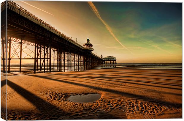 Shadows Of The Pier Canvas Print by John Hare