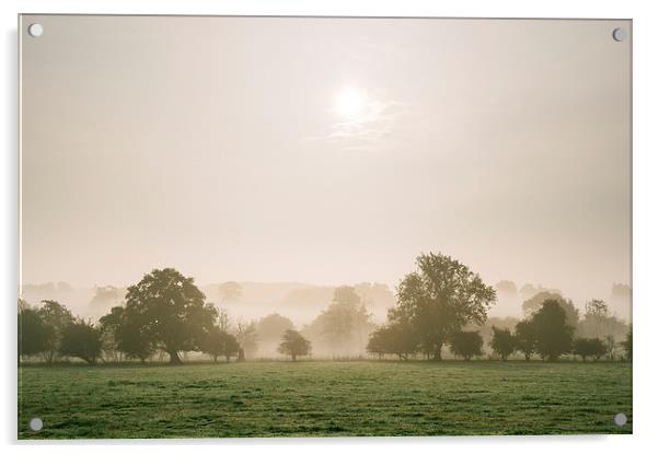 Sunrise burning through heavy fog over countryside Acrylic by Liam Grant