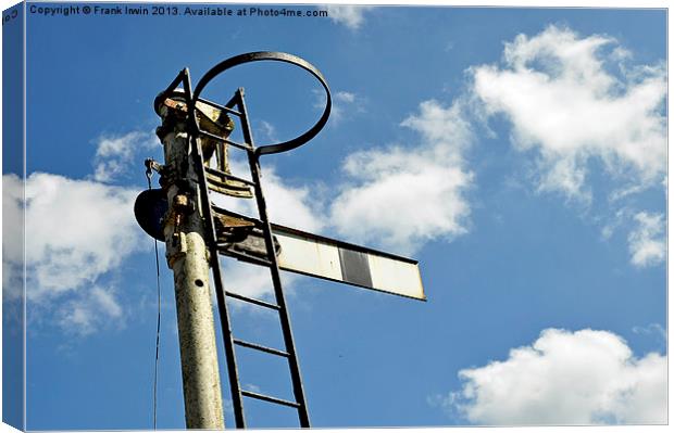 Semaphore type signal set against a blue sky Canvas Print by Frank Irwin