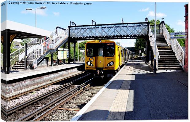 A Merseyrail train, above ground Canvas Print by Frank Irwin
