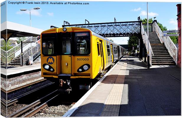 A Merseyrail train, above ground Canvas Print by Frank Irwin