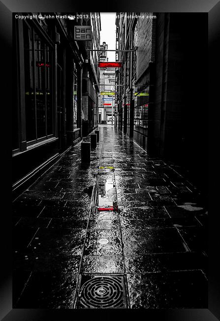 Rainy Lane on Sunday Framed Print by John Hastings