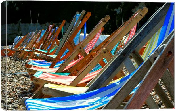 Deckchairs on the beach at Beer in Devon Canvas Print by Peter McCormack