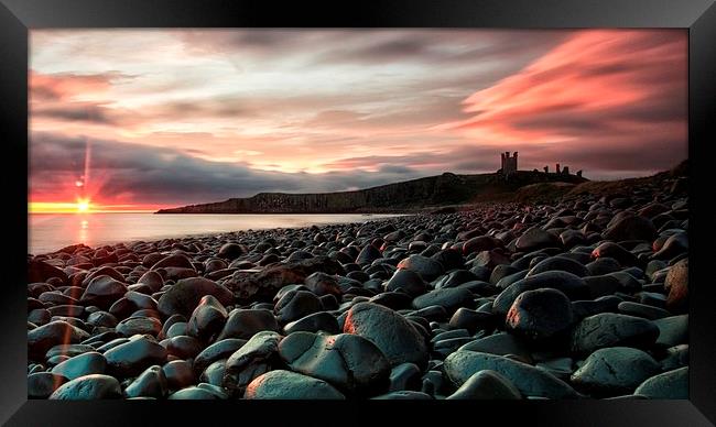 Dunstanburgh castle sunrise Framed Print by James Marsden
