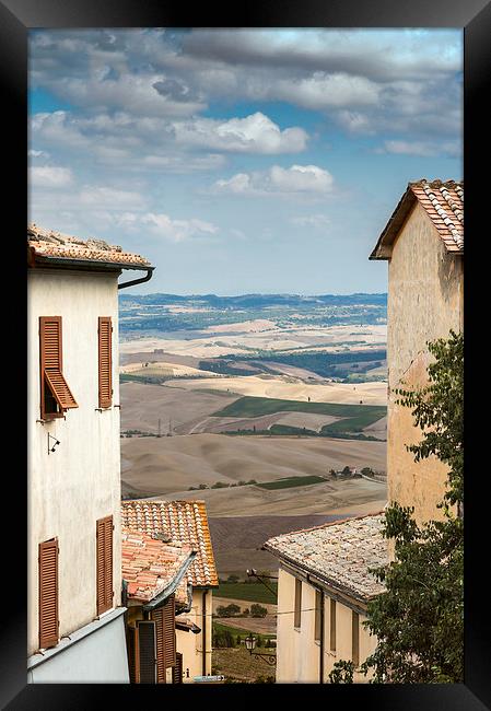 Tuscany through the houses Framed Print by Stephen Mole