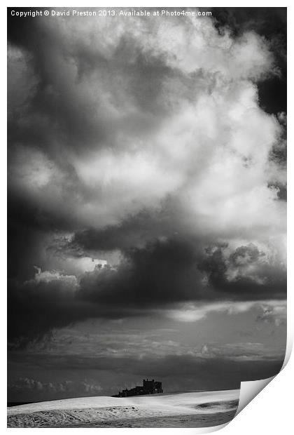 Bamburgh Castle and dramatic sky Print by David Preston
