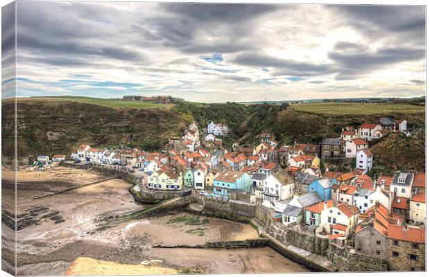 Tide out in Staithes Harbour Canvas Print by Alan Matkin